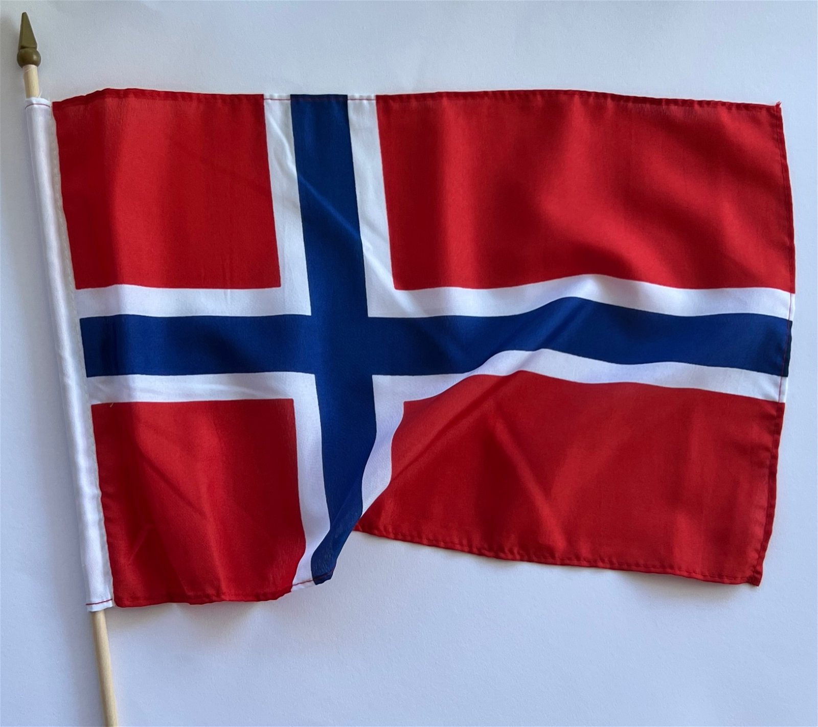 Norwegian flag on wooden stick